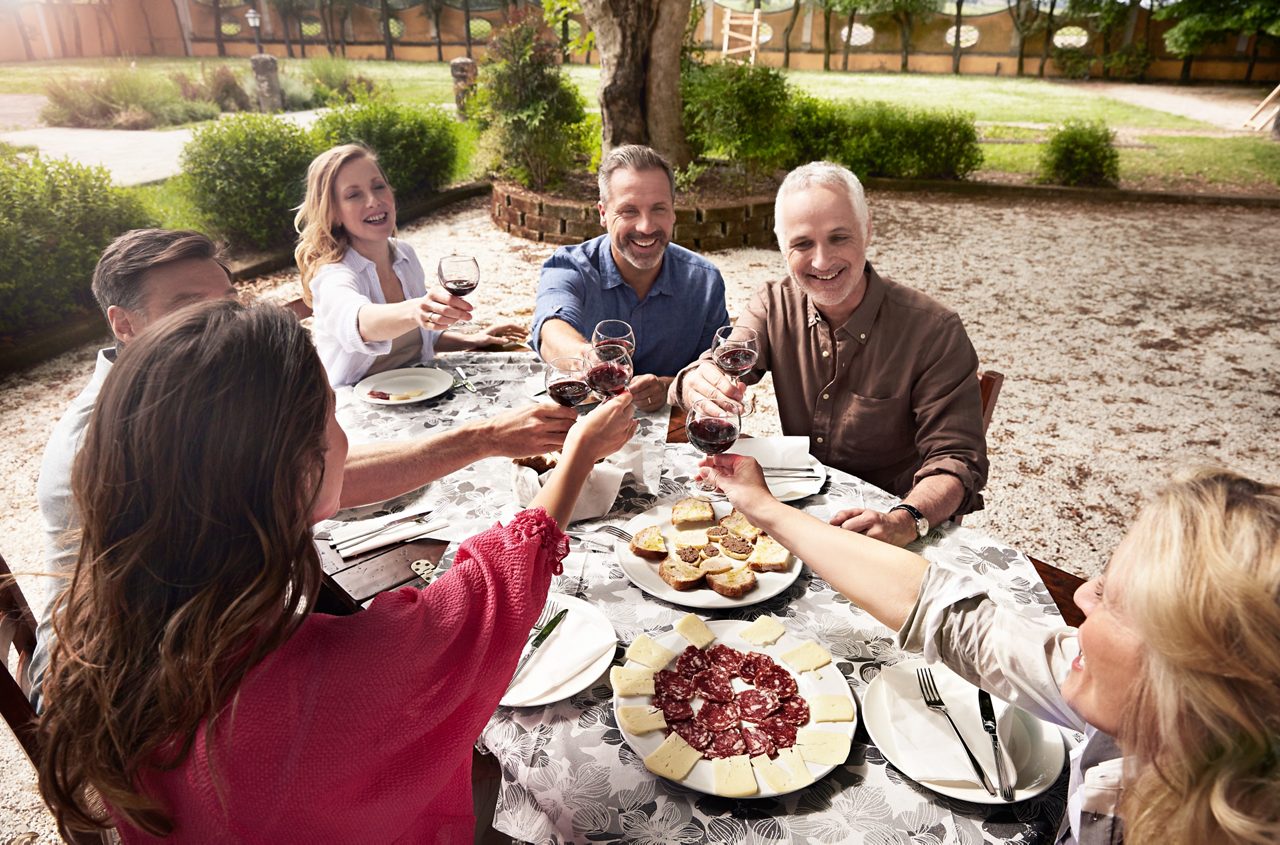 A small group wine tasting and toasting at an Italian winery.