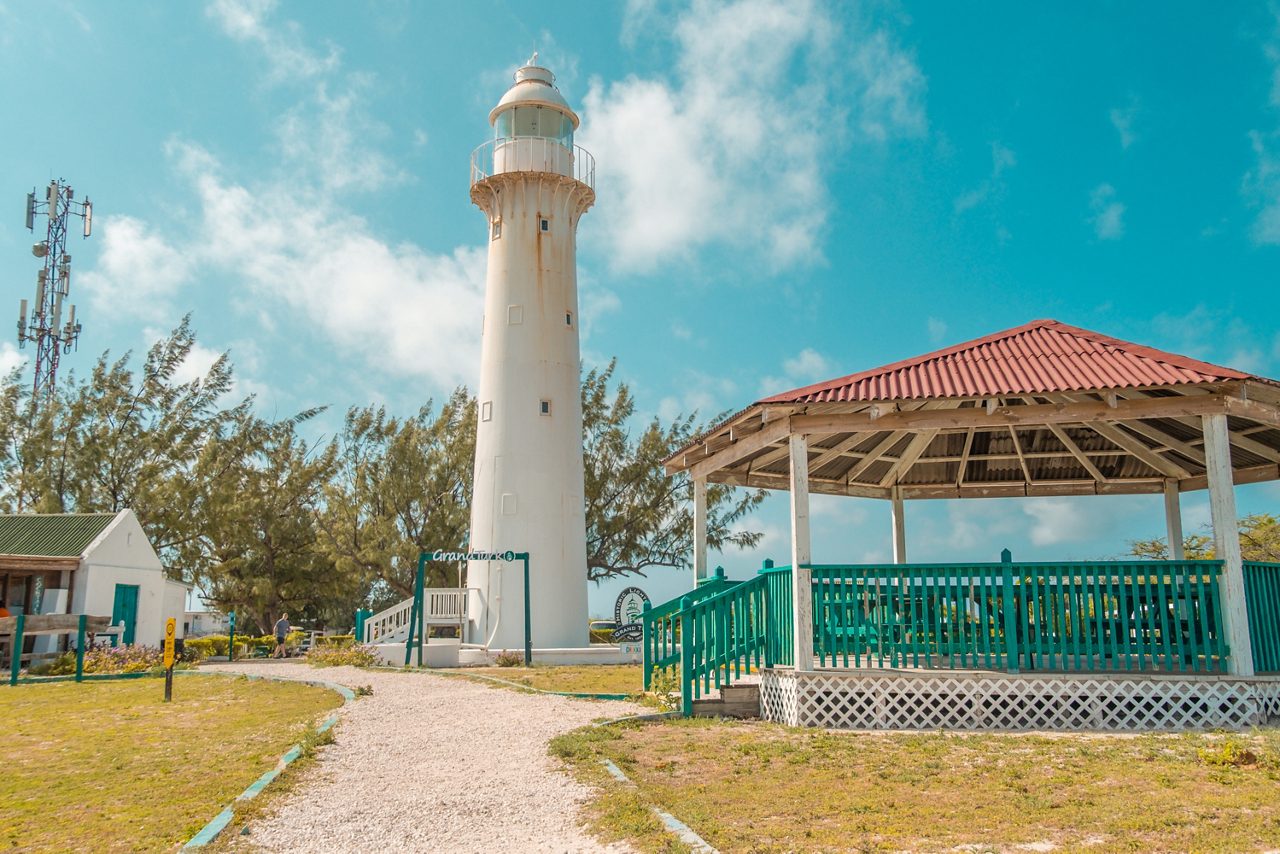 The Grand Turk Lighthouse towering over the island, with a nearby gazebo and 