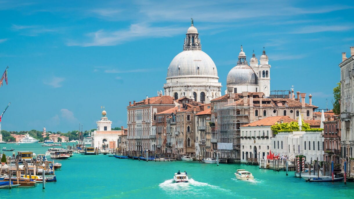 Majestic moments in Venice, Italy on the Grand Canal, watched over by the timeless beauty of St. Mark’s Basilica.