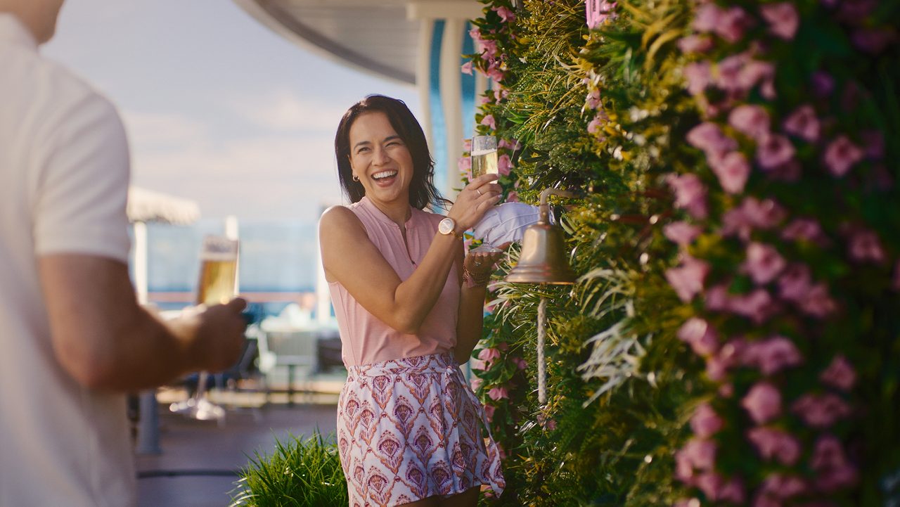 Woman serving a glass of champagne